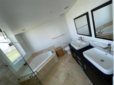 Updated 3-bed, 2-bath corner unit (built in 2007) overlooking on The Diplomat Golf Resort and Spa in Florida - for sale on GolfHomes.com, golf home, golf lot