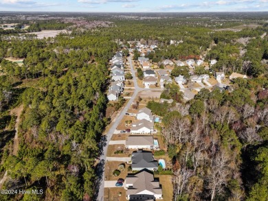 Beautiful custom-built home by Whitney Blair in Cape Side at on Pearl Golf Links in North Carolina - for sale on GolfHomes.com, golf home, golf lot