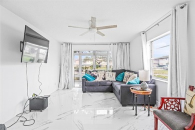Rarely available, completely renovated modern condo in Vista on The American Golf Club in Florida - for sale on GolfHomes.com, golf home, golf lot