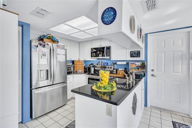 Welcome to this stunning two bedroom two bath villa nestled in a on Highland Lakes Executive Golf Course in Florida - for sale on GolfHomes.com, golf home, golf lot