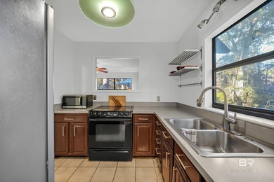 Welcome to your peaceful cottage in the woods, a private oasis on Lake Forest Yacht and Country Club in Alabama - for sale on GolfHomes.com, golf home, golf lot