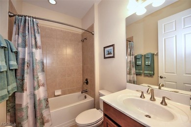 This open and bright home features high ceilings, abundant on Herons Glen Golf and Country Club in Florida - for sale on GolfHomes.com, golf home, golf lot