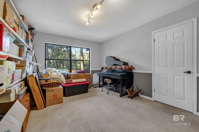 Welcome to your peaceful cottage in the woods, a private oasis on Lake Forest Yacht and Country Club in Alabama - for sale on GolfHomes.com, golf home, golf lot