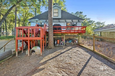 Welcome to your peaceful cottage in the woods, a private oasis on Lake Forest Yacht and Country Club in Alabama - for sale on GolfHomes.com, golf home, golf lot