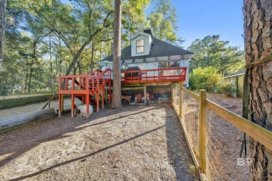 Welcome to your peaceful cottage in the woods, a private oasis on Lake Forest Yacht and Country Club in Alabama - for sale on GolfHomes.com, golf home, golf lot