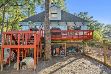 Welcome to your peaceful cottage in the woods, a private oasis on Lake Forest Yacht and Country Club in Alabama - for sale on GolfHomes.com, golf home, golf lot