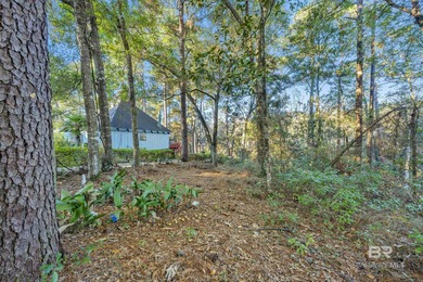 Welcome to your peaceful cottage in the woods, a private oasis on Lake Forest Yacht and Country Club in Alabama - for sale on GolfHomes.com, golf home, golf lot