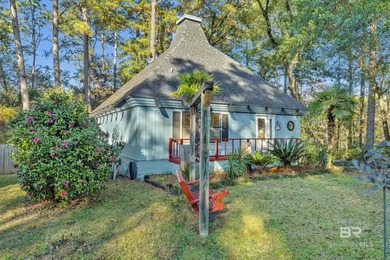 Welcome to your peaceful cottage in the woods, a private oasis on Lake Forest Yacht and Country Club in Alabama - for sale on GolfHomes.com, golf home, golf lot