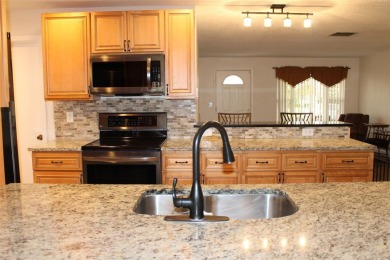 This is a very special remodeled, Drayton, single family home on Mainlands Golf Club in Florida - for sale on GolfHomes.com, golf home, golf lot