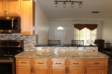 This is a very special remodeled, Drayton, single family home on Mainlands Golf Club in Florida - for sale on GolfHomes.com, golf home, golf lot