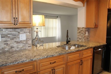 This is a very special remodeled, Drayton, single family home on Mainlands Golf Club in Florida - for sale on GolfHomes.com, golf home, golf lot