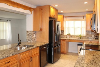 This is a very special remodeled, Drayton, single family home on Mainlands Golf Club in Florida - for sale on GolfHomes.com, golf home, golf lot