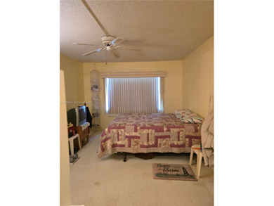 Spacious 1-bedroom, 1.5-bath first-floor condo offering serene on Sunrise Lakes Phase III in Florida - for sale on GolfHomes.com, golf home, golf lot