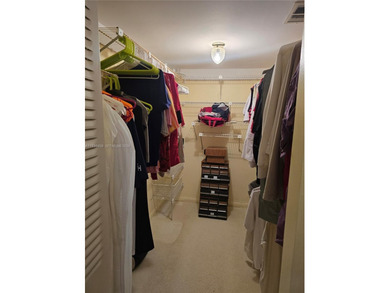 Spacious 1-bedroom, 1.5-bath first-floor condo offering serene on Sunrise Lakes Phase III in Florida - for sale on GolfHomes.com, golf home, golf lot