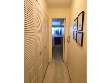 Spacious 1-bedroom, 1.5-bath first-floor condo offering serene on Sunrise Lakes Phase III in Florida - for sale on GolfHomes.com, golf home, golf lot