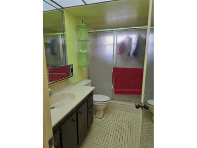 Spacious 1-bedroom, 1.5-bath first-floor condo offering serene on Sunrise Lakes Phase III in Florida - for sale on GolfHomes.com, golf home, golf lot