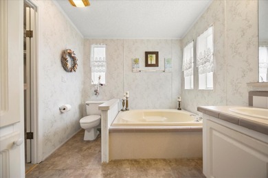 Stunning 3BR/2BA Triple-Wide with Versatile Bonus Room. This on Zellwood Station Country Club in Florida - for sale on GolfHomes.com, golf home, golf lot