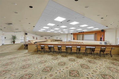 Spacious 1-bedroom, 1.5-bath first-floor condo offering serene on Sunrise Lakes Phase III in Florida - for sale on GolfHomes.com, golf home, golf lot