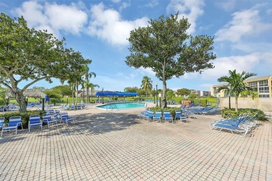 Spacious 1-bedroom, 1.5-bath first-floor condo offering serene on Sunrise Lakes Phase III in Florida - for sale on GolfHomes.com, golf home, golf lot