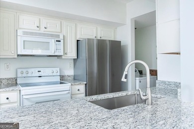 Elevated living awaits in this beautifully appointed one-bedroom on Bobby Jones Golf Club in Georgia - for sale on GolfHomes.com, golf home, golf lot