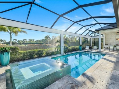 Sophisticated, serene, contemporary, and warm, this absolutely on The Golf Club At Fiddlers Creek in Florida - for sale on GolfHomes.com, golf home, golf lot