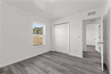 This new construction home has 4 bedrooms and two full bathrooms on Citrus Springs Country Club in Florida - for sale on GolfHomes.com, golf home, golf lot