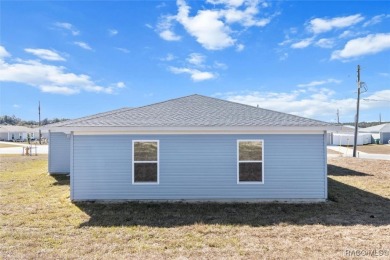 This new construction home has 4 bedrooms and two full bathrooms on Citrus Springs Country Club in Florida - for sale on GolfHomes.com, golf home, golf lot