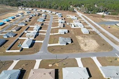 This new construction home has 4 bedrooms and two full bathrooms on Citrus Springs Country Club in Florida - for sale on GolfHomes.com, golf home, golf lot