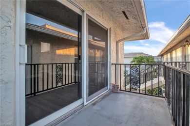 Wonderful second floor unit looking out on the water of the on The Glades Golf and Country Club in Florida - for sale on GolfHomes.com, golf home, golf lot