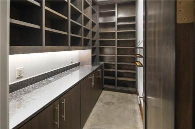 Experience luxury redefined in this private 6,021 SqFt custom on The Traditions Club At Texas A and M in Texas - for sale on GolfHomes.com, golf home, golf lot