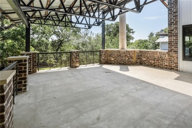 Experience luxury redefined in this private 6,021 SqFt custom on The Traditions Club At Texas A and M in Texas - for sale on GolfHomes.com, golf home, golf lot