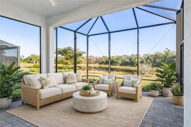 This sophisticated lakefront residence in The Falls at Grand on Oak Harbor Country Club in Florida - for sale on GolfHomes.com, golf home, golf lot