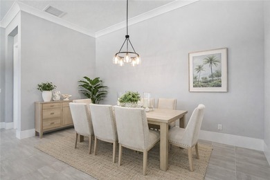 This sophisticated lakefront residence in The Falls at Grand on Oak Harbor Country Club in Florida - for sale on GolfHomes.com, golf home, golf lot