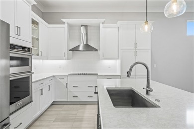 This sophisticated lakefront residence in The Falls at Grand on Oak Harbor Country Club in Florida - for sale on GolfHomes.com, golf home, golf lot