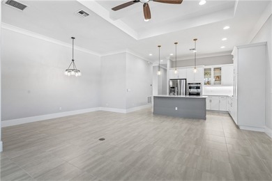 This sophisticated lakefront residence in The Falls at Grand on Oak Harbor Country Club in Florida - for sale on GolfHomes.com, golf home, golf lot