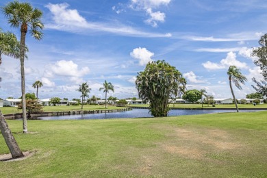 Indulge in the epitome of South Florida living! Imagine waking on Leisureville Community Golf Course in Florida - for sale on GolfHomes.com, golf home, golf lot