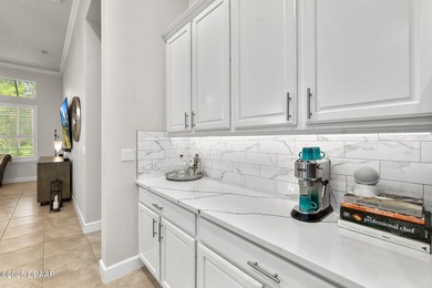 Nestled inside the guard gated, golf-cart-friendly community of on Plantation Bay Golf and Country Club in Florida - for sale on GolfHomes.com, golf home, golf lot