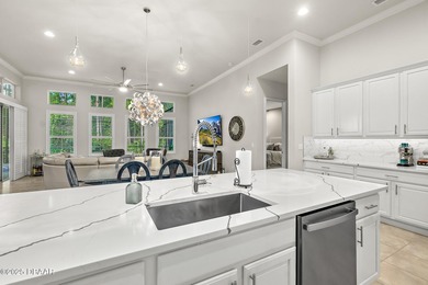 Nestled inside the guard gated, golf-cart-friendly community of on Plantation Bay Golf and Country Club in Florida - for sale on GolfHomes.com, golf home, golf lot