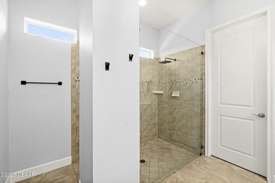 Nestled inside the guard gated, golf-cart-friendly community of on Plantation Bay Golf and Country Club in Florida - for sale on GolfHomes.com, golf home, golf lot