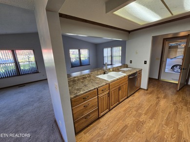 Enjoy golf frontage in your backyard while on the main drag of on Lake Tansi Village Country Club in Tennessee - for sale on GolfHomes.com, golf home, golf lot