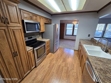 Enjoy golf frontage in your backyard while on the main drag of on Lake Tansi Village Country Club in Tennessee - for sale on GolfHomes.com, golf home, golf lot