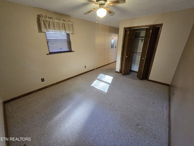 Enjoy golf frontage in your backyard while on the main drag of on Lake Tansi Village Country Club in Tennessee - for sale on GolfHomes.com, golf home, golf lot
