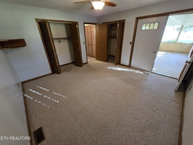 Enjoy golf frontage in your backyard while on the main drag of on Lake Tansi Village Country Club in Tennessee - for sale on GolfHomes.com, golf home, golf lot