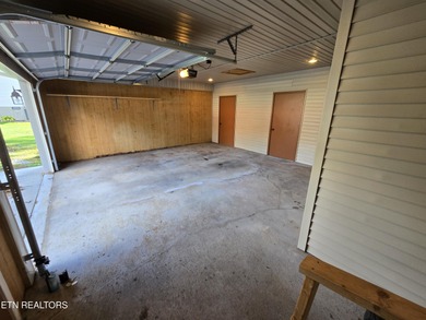 Enjoy golf frontage in your backyard while on the main drag of on Lake Tansi Village Country Club in Tennessee - for sale on GolfHomes.com, golf home, golf lot