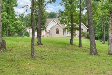 Welcome to resort-style living in this lovely custom ranch with on Raintree Country Club in Missouri - for sale on GolfHomes.com, golf home, golf lot