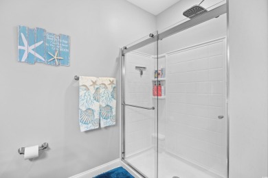 Enjoy low-maintenance resort living in this spacious 3-bedroom on Barefoot Resort and Golf Club  in South Carolina - for sale on GolfHomes.com, golf home, golf lot