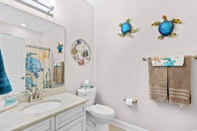 Enjoy low-maintenance resort living in this spacious 3-bedroom on Barefoot Resort and Golf Club  in South Carolina - for sale on GolfHomes.com, golf home, golf lot