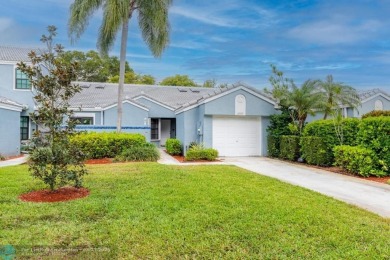 This beautifully and totally updated 2-bed, 2-bath townhouse on Woodmont Country Club in Florida - for sale on GolfHomes.com, golf home, golf lot