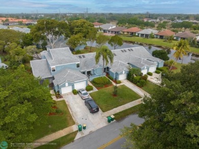 This beautifully and totally updated 2-bed, 2-bath townhouse on Woodmont Country Club in Florida - for sale on GolfHomes.com, golf home, golf lot