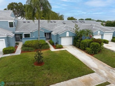 This beautifully and totally updated 2-bed, 2-bath townhouse on Woodmont Country Club in Florida - for sale on GolfHomes.com, golf home, golf lot